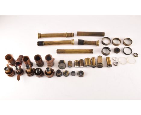 A box of miscellaneous telescope items, including an R &amp; J Beck Ltd brass telescope draw (with glass), London 1915, no. 1
