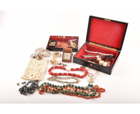 A group of costume jewellery including a rose metal and opal ring, gold metal charms and studs, a pearl necklace, a coral nec
