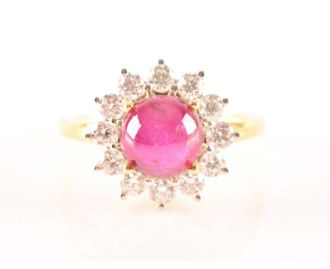 A 18ct yellow gold cabochon ruby cluster ring, set with a central Burmese round cabochon ruby with an approximate weight of 1