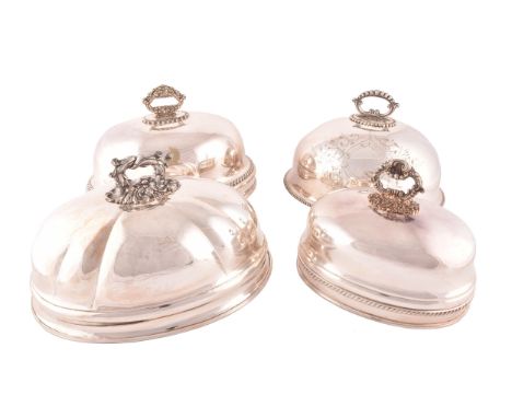 A group of four Victorian silver plated meat domes,&nbsp;with ornate handles, some with engraved decoration.