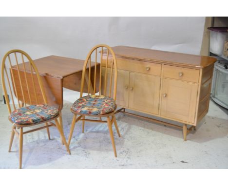 Ercol, a dining room suite, comprising a drop leaf table, four Quaker back Windsor chairs, and a sideboard (model 351) (6)