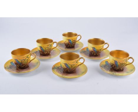 Reginald Johnson for Doulton Burslem, a set of coffee cans and saucers painted with kingfishers, 1927, gilt interior to cups,