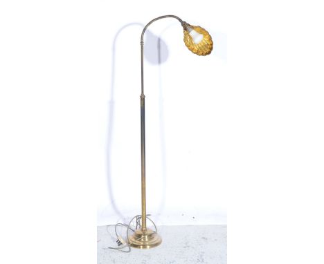 Lacquered brass floor lamp, shell shade, adjustable.