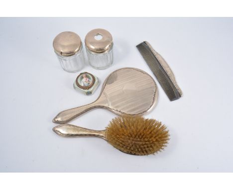 Silver mounted hand mirror, engine turned decoration, 27cm, a similar brush, comb, two silver mounted jars and a small Victor