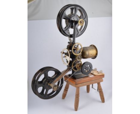 Early hand cranked silent movie projector, lacking lamp.