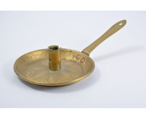 Victorian brass chamber stick, circular drip pan with stamped heart motifs, decorated handle, 29cm.