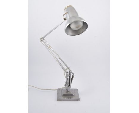Herbert Terry & Sons, a polished steel angle poise lamp, circa 1925, stepped square section base.