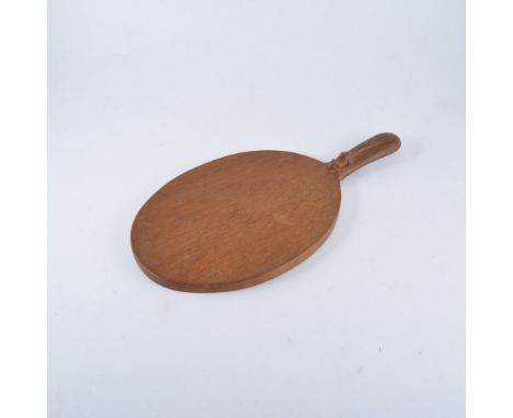 Robert "Mouseman" Thompson of Kilburn, an adzed oak cheeseboard, oval with handle, carved signature mouse, 26cm x 18cm