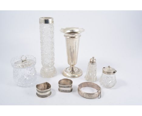 Silver pedestal vase, weighted base, cut-glass vase with silver mount, two silver napkin rings, bangle, etc.