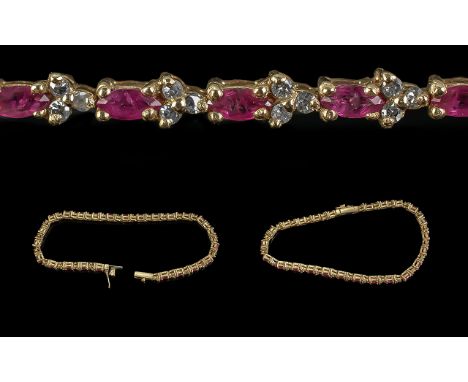 9ct Gold Ruby & Diamond Bracelet, weight 7.35 grams. The rubies set between diamond spacers.