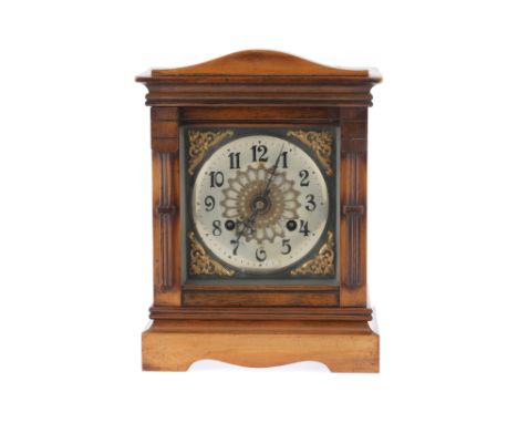 A Victorian Walnut and Stained Beech Mantle Clock, with silvered Arabic numeral dial, striking on coiled rod 30.5 cm H