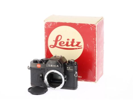 A Leica R3 35mm SLR Camera Body black, body F, light marks to lens mount, small dent to prism housing, with batteries inserte