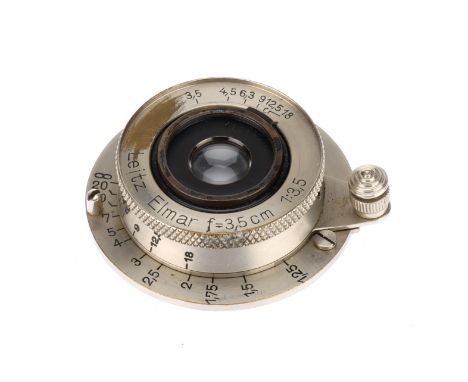 A Leitz Elmar f/3.5 3,5cm Lens screw mount, body F, front identity ring partly scratched off, mechanically G, optically F wit
