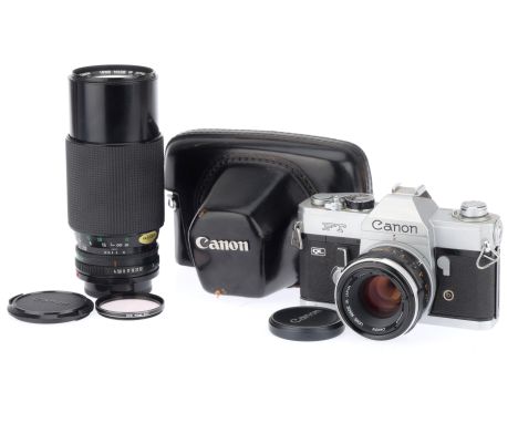 A Canon FT QL SLR Camera, silver, serial number 770187, shutter works but slow at 1 sec, with Canon FL f/1.8 50mm lens, barre