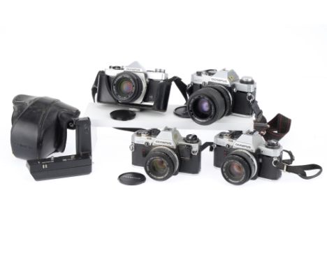 A Group of Olympus OM 35mm SLR Cameras comprising an OM-1N camera with a Zuiko Auto-S f/1.8 50mm lens, shutter working, meter