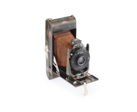 A Houghton-Butcher Ensign No.4 Carbine Folding Camera, brass, body G, belllows extends but not light tested, hand chain broke