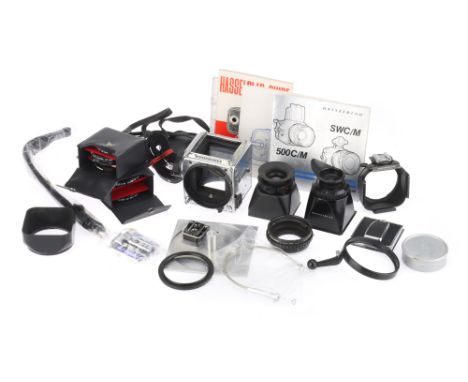 A Selection of Hasselblad Camera Components, to include a 2000FC body, condition P, various finders, filters, straps, guides.