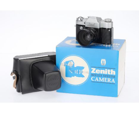 A Krasnogorsk Zenit 35mm SLR Camera, silver, serial number 66090303, body F-G, some lifting of leatherette, shutter works but