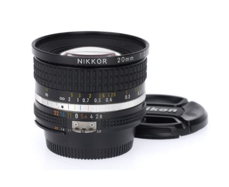 A Nikon Nikkor f/2.8 20mm Ai Camera Lens, black, serial number 261667, barrel VG, iris works, aperture blades move quickly, o
