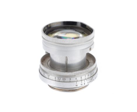 A Leitz Wetzlar f/2 5cm Summitar Lens, chrome, serial number 860157, serious dent to filter ring, haas cause separation in th