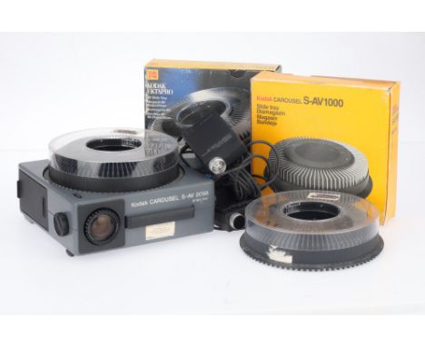 A Kodak Carousel S-AV 2050 Slide Projector, black, body G, working at time of auction, together with two remote receivers, a 