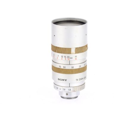 A Sony f/1.8 12.5-75mm TV Lens, silver, barrel F, c-mount, optics F-G with dust and light haze.
