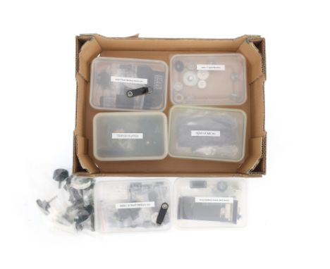 A Selection of Camera Components and Spares, to include battery covers and doors, tripod plates, and other parts, organised i