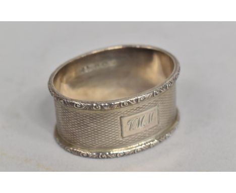 A Silver Napkin Ring with Engine Turned Decoration 