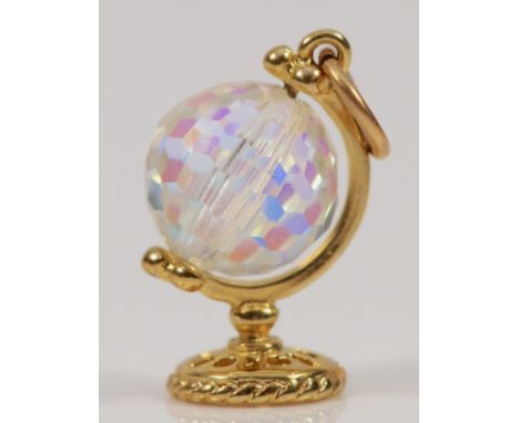 A 9ct gold glass spinning globe charm, 15mm, 1.3g