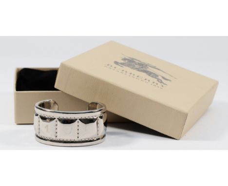 Burberry, a gilt metal wide cuff bangle, 55mm, 45g, with bag and box