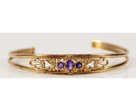 A 9ct gold amethyst bangle, 63mm internal, 6.6g