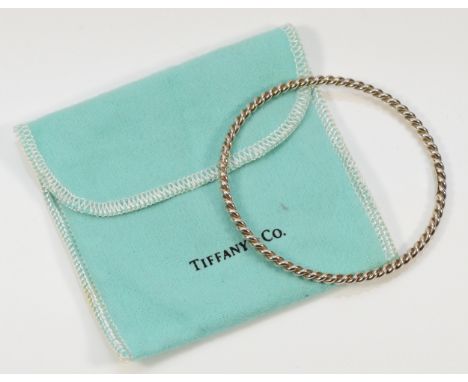 Tiffany &amp; Co, sterling silver twisted bangle with a pouch, Tiffany &amp; Co London 2012, 60mm internal diameter, 12g