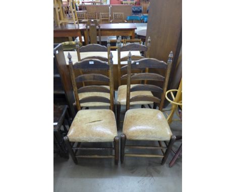 A set of four Victorian elm and oak ladder back dining chairs 