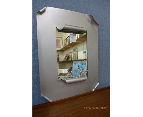 A steel framed McPhail Collection mirror, by Scottish sculptor John McPhail, 50 x 38cms 