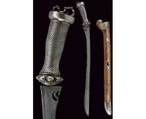 An interesting dagger dating: circa 1900 provenance: Bali Long, straight blade of fine pamor, widened toward the tip, grooved