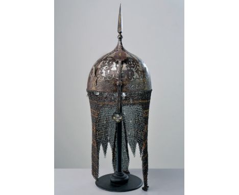 A rare silver-encrusted khula-khud dating: 18th Century provenance: Indopersia Strong, iron skull of hemispherical shape, wit