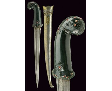 A very fine kandshar with jade hilt and red stones dating: circa 1800 provenance: Turkey Strong, straight, damask blade, slig