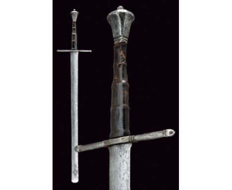 An execution sword dating: 17th Century provenance: Europe Long, straight, double-edged blade, with rounded tip (pitting) fea