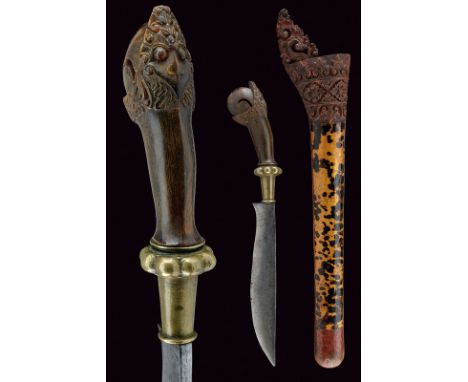 A kleewang dating: 19th Century provenance: Malaysia Strong, iron blade with curved edge, horn grip finely chiselled with a m