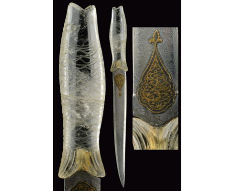 A dagger dating: 20th Century provenance: India Almost straight, double-edged, damascened blade of lenticular section, at the