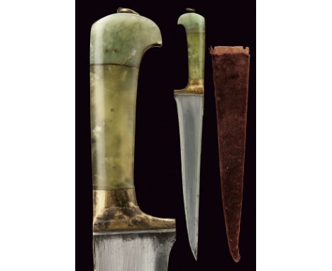 A pesh-kabz dating: 19th Century provenance: India Straight, single-edged blade with "T"-back; grip with jade grip scales, br