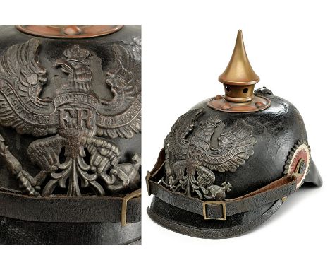 An infantry helmet Mod. 1895 dating: early 20th Century provenance: Prussia Black leather skull (defects); brass cusps with r