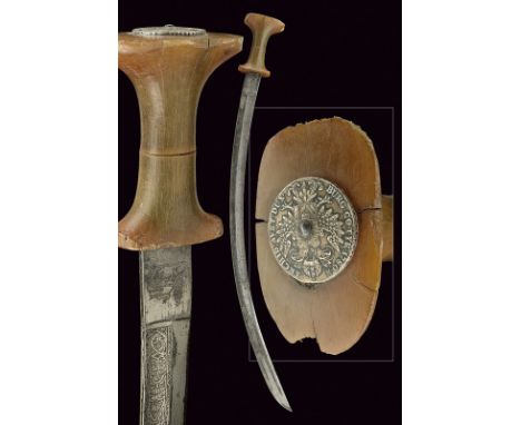 A guradé dating: late 19th Century provenance: Abissinia Curved, single-edged blade with wide fuller, engraved with floral an