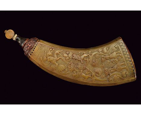 A beautiful carved powder-flask dating: last quarter of the 18th Century provenance: Germany Of pressed cow horn; featuring b