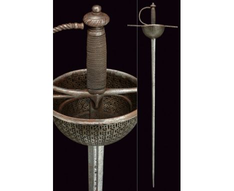 A fine cup-hilted sword dating: 19th Century provenance: Spain Straight, double-edged blade of hexagonal section, grooved at 