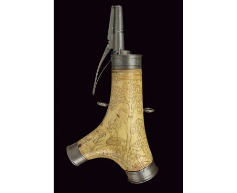 A powder-flask dating: 17th Century provenance: Germany Of stag horn; the fort surface engraved with effigy of hunters and ho
