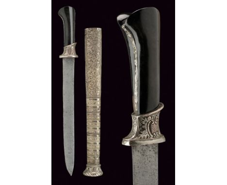 A silver mounted dagger dating: 19th Century provenance: Indonesia Simple, straight, single-edged blade; silver-plated hilt e