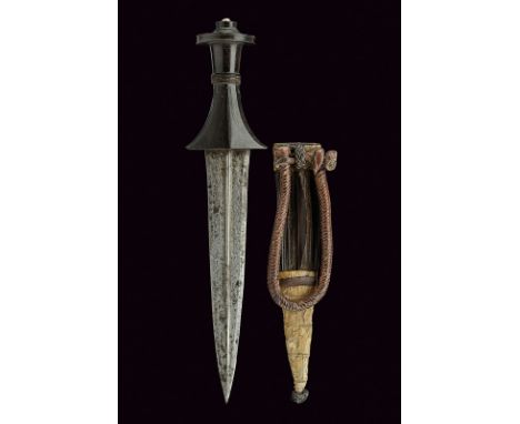 An arm dagger dating: circa 1900 provenance: Sudan Straight, double-edged blade with central raiser, engraved at the base; sc