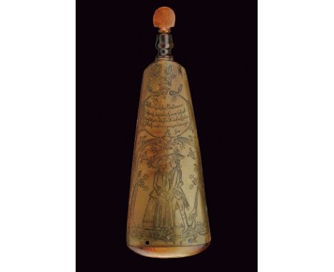 An engraved powder-flask dating: 18th Century provenance: Germany Body of pressed cow horn, one face engraved with the effigy