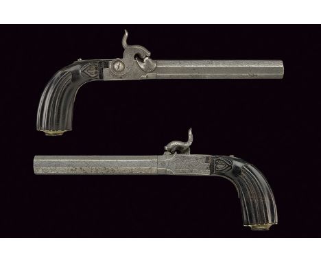 A pair of percussion pistols dating: mid-19th Century provenance: Belgium Smooth, octagonal, damask, 12 mm cal. barrels; boxl